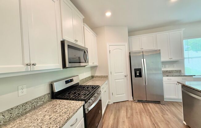 Modern 3BD, 2.5BA Raleigh Home in a Great Location with a Covered Patio and Private Backyard