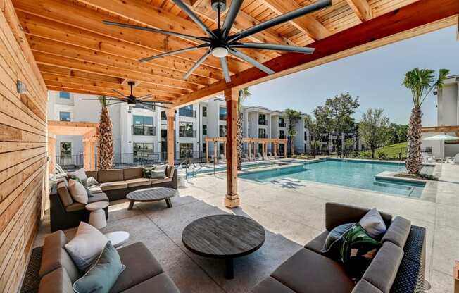 the preserve at ballantyne commons pool and patio with couches and tables