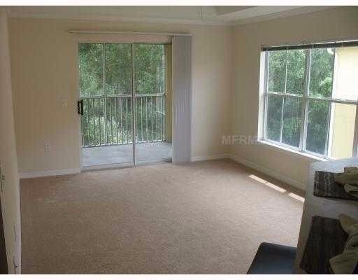 Well maintained condo, water included, in a GATED COMMUNITY with community POOL at heart of new Tampa