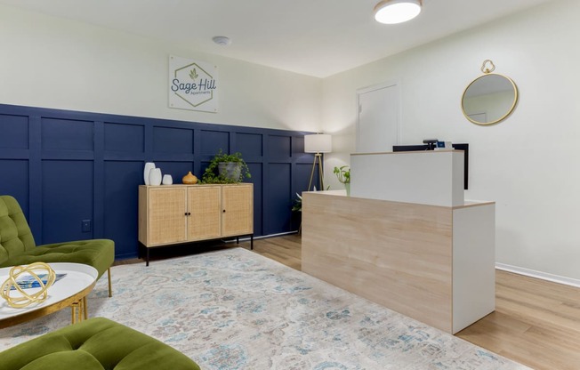 a living room with a blue and white rug and a reception desk
