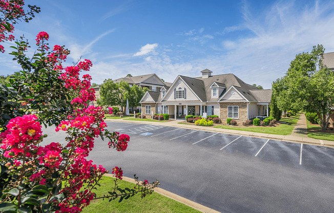 A building with a parking lot in front of it.
