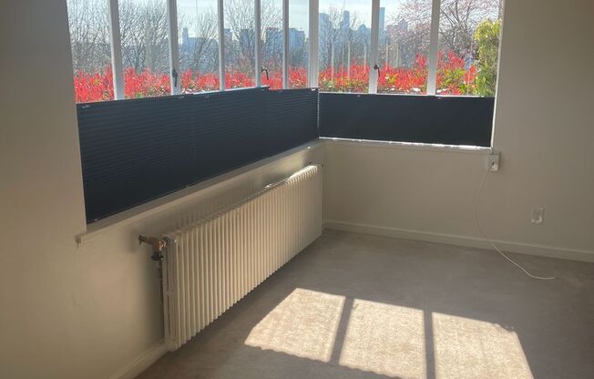 Cute and Cozy East Queen Anne Condo with 2 Bedrooms, 1 Bath and 1 Covered Parking Space