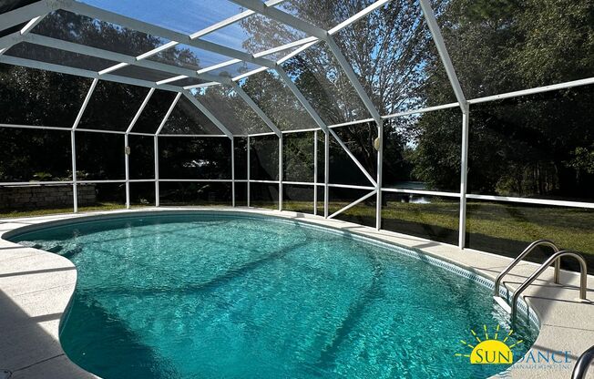 Lakefront home with Enclosed pool centered between Eglin and Hurlburt