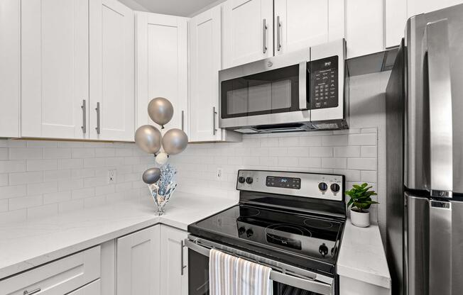 a stove top oven sitting inside of a kitchen