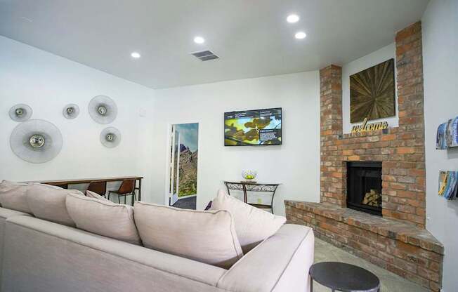 A living room with a fireplace and a couch.