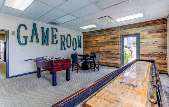 Game room with a pool table and game room sign  at Union Heights Apartments, Colorado Springs, CO