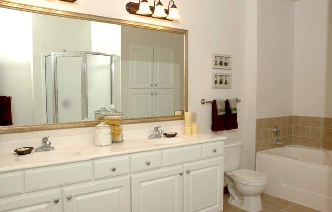 large bathroom with double vanity in select homes