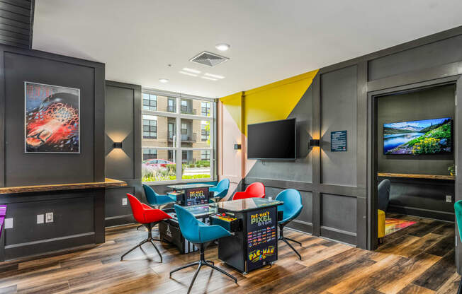a game room with a table and chairs and a tv