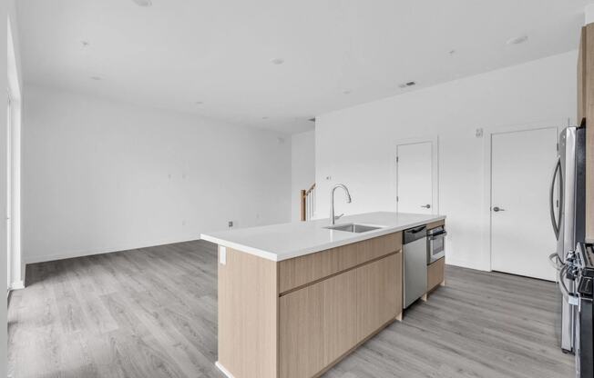 A kitchen with a sink, stove, and oven at The Franklin Marlboro Apartments, Marlboro