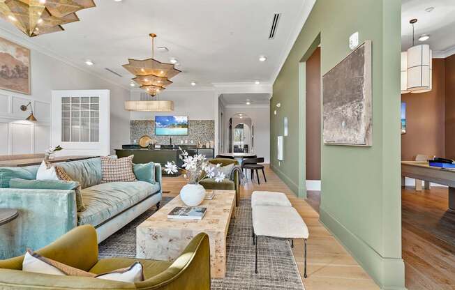 A modern living room with a green couch and a coffee table.