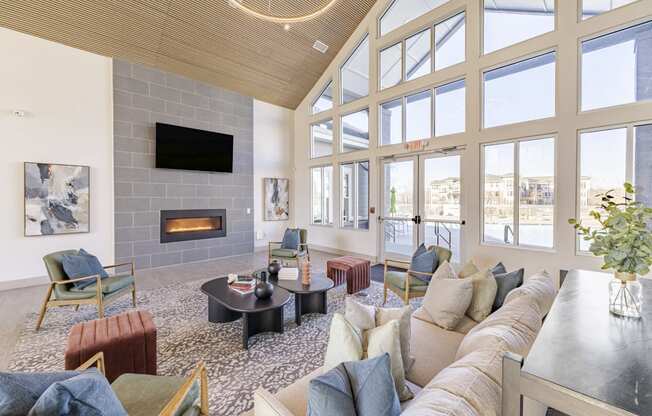 Community room with couches and chairs and fireplace at Sycamore at Tyvola, Charlotte, NC