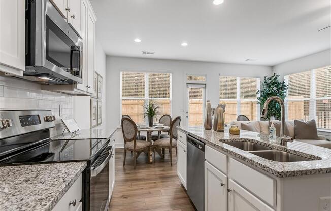 a kitchen with a sink and a counter top