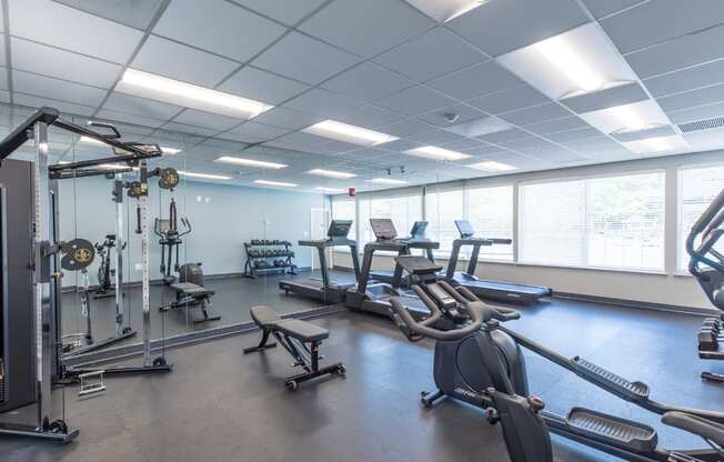 a gym with various exercise machines and weights