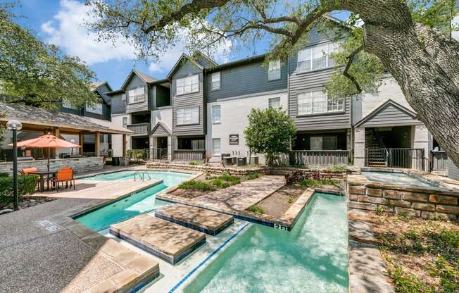 our apartments have a swimming pool and a courtyard with trees