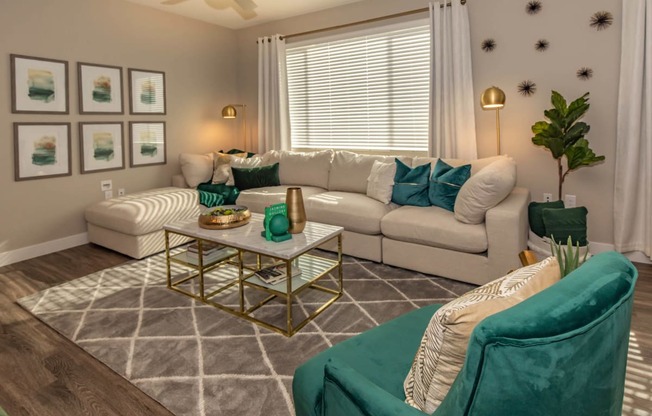 Livng room with couch and frames at Level 25 at Cactus by Picerne, Las Vegas, NV, 89141
