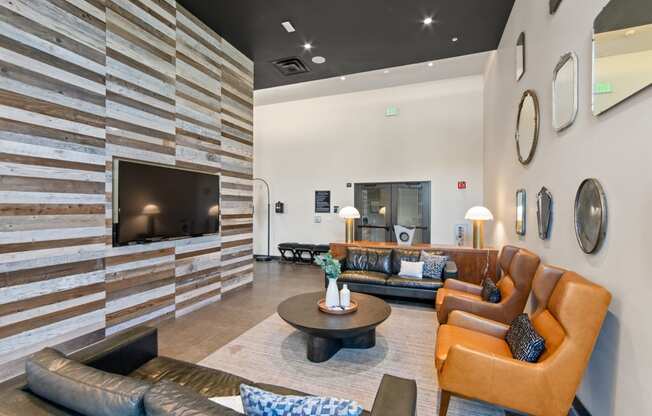 Common Area with Television and Couches at Aventine Apartments in Hercules, CA 94547