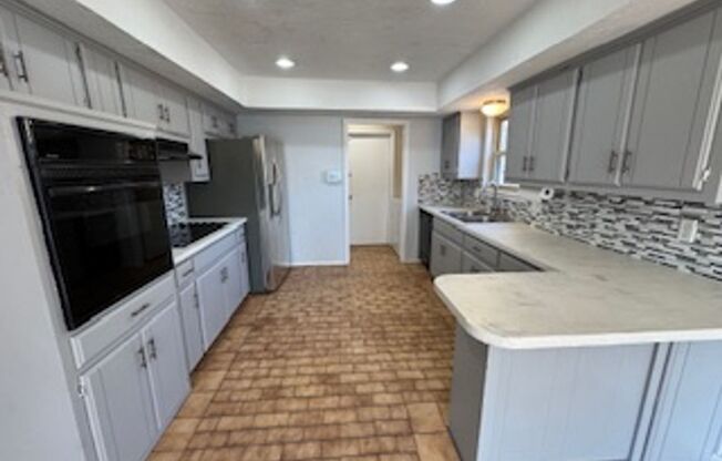 Updated Modern bathrooms, spacious bedrooms, large living , fenced yard, fridge and washer and dryer available.