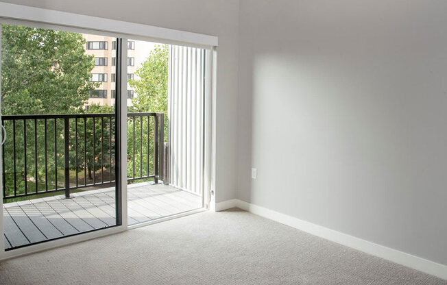 Nordic bedroom with tv wall and balcony at Urban Park I and II Apartments, St Louis Park, 55426