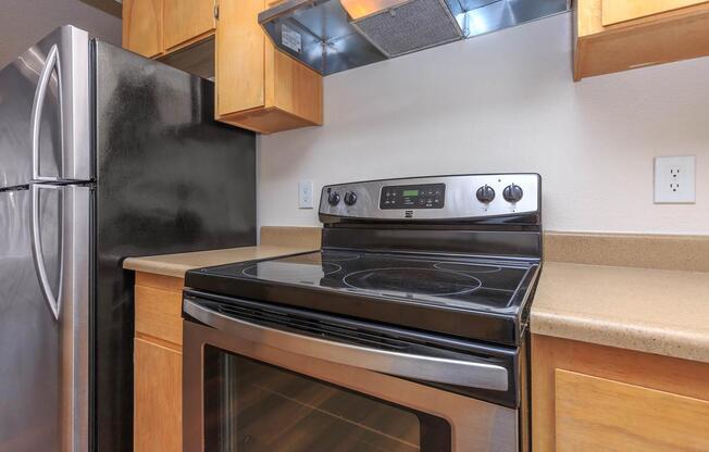 a stove top oven sitting inside of a kitchen