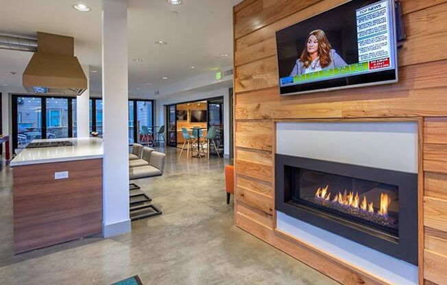 a living room with a fireplace and a tv