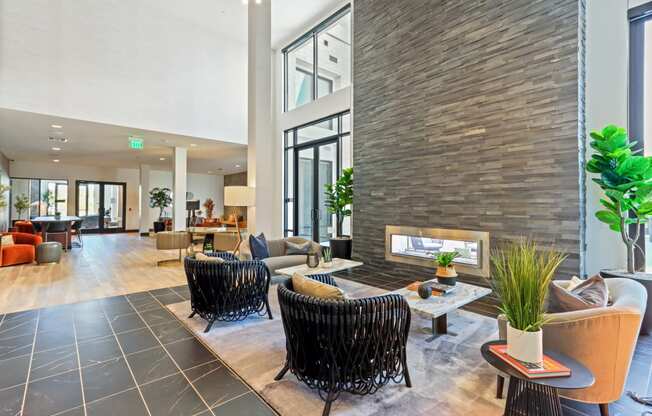 Living room with a fireplace and a large window at Array La Mesa, California