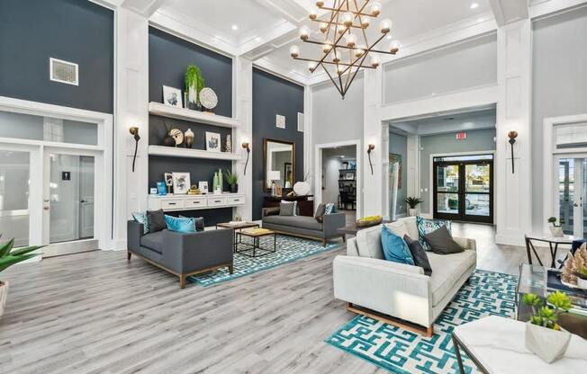 Community lounge with sofas at Park West Apartments in Houston, Texas