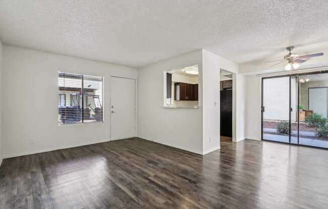 A room with wooden floors and white walls.