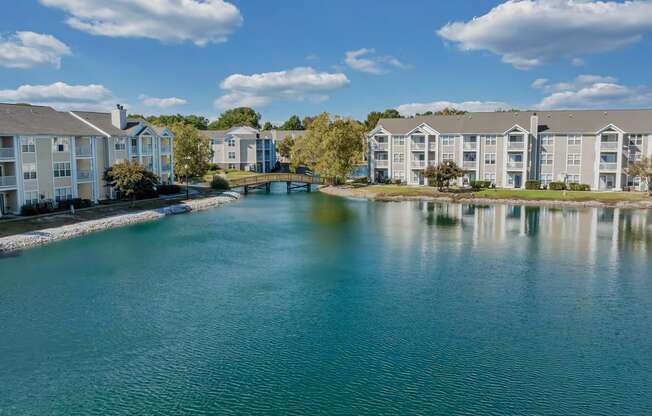 a large body of water with apartment buildings on the side of it