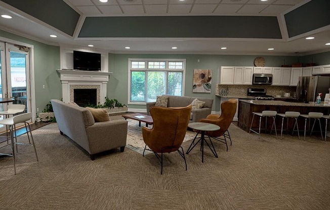 a living room with a table and chairs and a fireplace