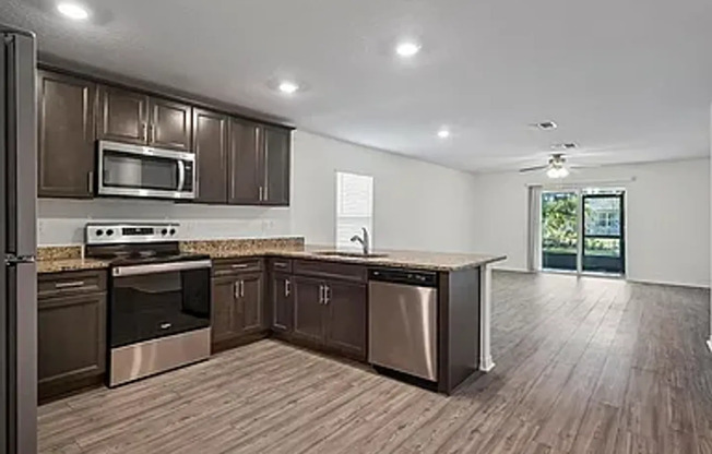 Like New 4/2/2 with screened in porch.