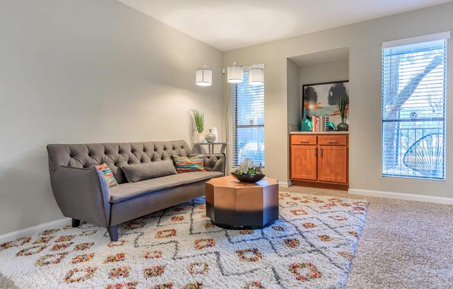 a living room filled with furniture and a flat screen tv