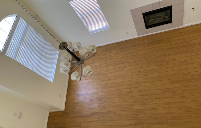 Two story home in gated community with community pool, featuring 4 bedrooms including one bedroom downstairs with a private bathroom! Home has a large great room with high ceilings that's visible from the second floor! Open kitchen with granite countertop