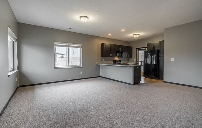 Interiors- Large living space with abundant natural light at the Villas of Omaha at Butler Ridge in Omaha Nebraska