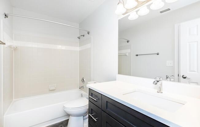 a room with a sink and a mirror