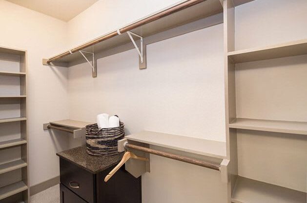 StoneLedge Apartments - walk in closets custom shelving - Grapevine Lake Apartments