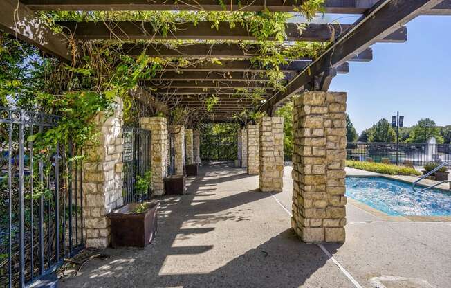 A shady pergola overlooking the pool at Cypress Lake at Stonebriar in Frisco, TX!