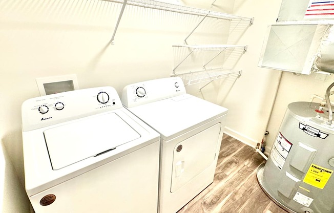 A washer and dryer in a small room.