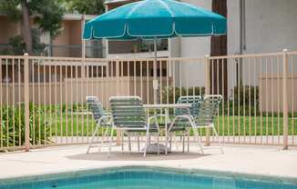 Swimming Pool Area With Shaded Chairs at Diablo Pointe, California, 94596
