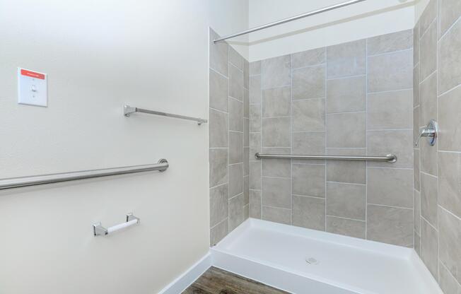 Apartments in Leander TX - Hills at Leander Expansive Bathroom with a Large Vanity, Shower, and Much More