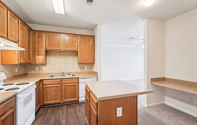 A kitchen with wooden cabinets and a white appliances