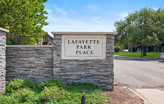 a stone wall with a sign that reads lafayette park at Lafayette Park Place, Detroit, MI, Detroit