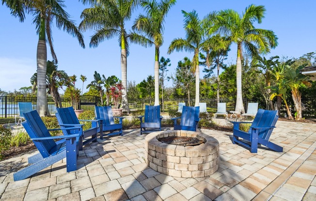 Firepit with chairs surrounding it on a sunny day