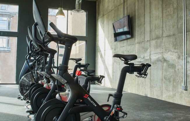 a row of bikes parked in a room