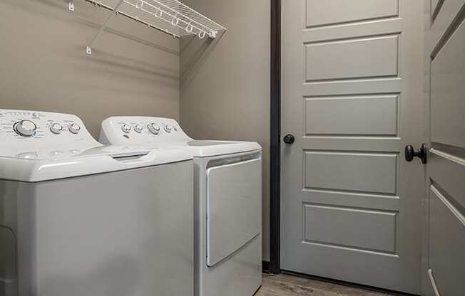 Full sized washer and dryer and laundry room in unit  at North Pointe Villas