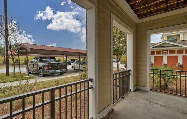 a covered porch with a truck parked in a parking lot at Nexus at Sandhill, South Carolina 