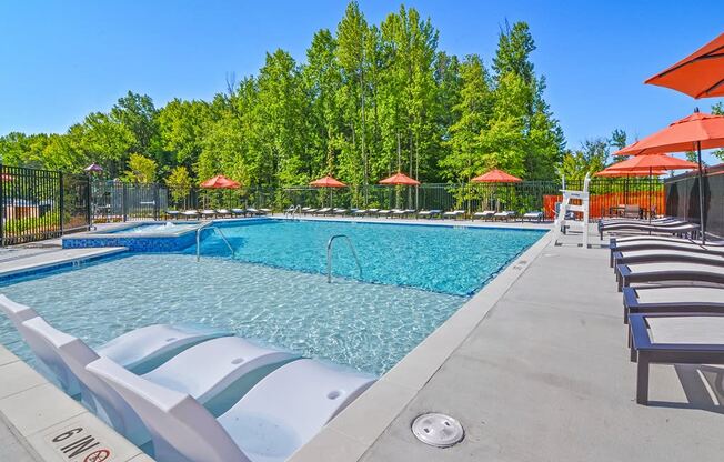 the reserve at city center spacious pool with chairs and umbrellas