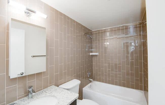 a bathroom with a sink toilet and bathtub