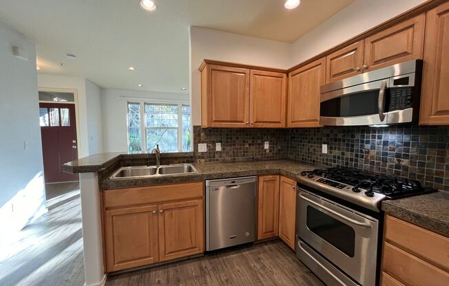 Cozy 3 Bed 2.5 Bath Townhouse in Bethany neighborhood! Attached garage and in unit washer/dryer!