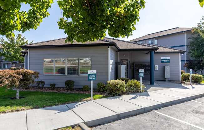 a small gray house with a sidewalk in front of it  at Shoreline Village, Washington