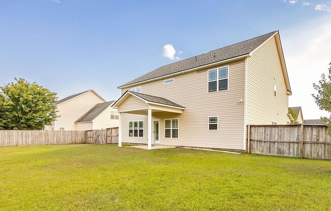 Welcome to this charming 4-bedroom, 3.5-bath home in Raeford